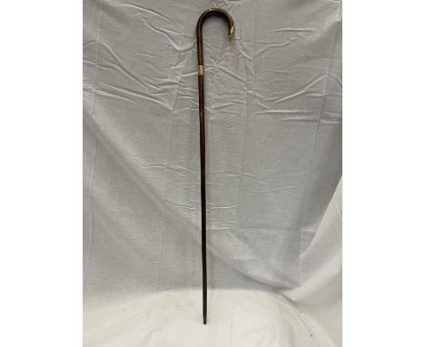 A WALKING STICK WITH A 9 CARAT GOLD FINIAL AND MATCHING TIP 