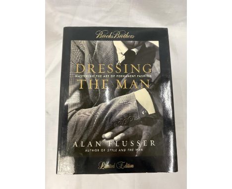 A FIRST EDITION DRESSING THE MAN BY ALAN FLUSSER 