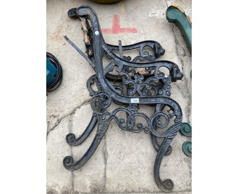 A PAIR OF DECORATIVE CAST IRON BENCH ENDS WITH LION HEAD DECORATION 
