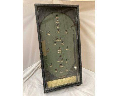 A RETRO BAGATELLE GAME IN GLASS COVERED CASE LABELLED 'THE PIXIE PIN GAME' 
