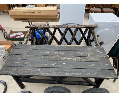 A RUSTIC GARDEN TABLE WITH MATCHING BENCH 