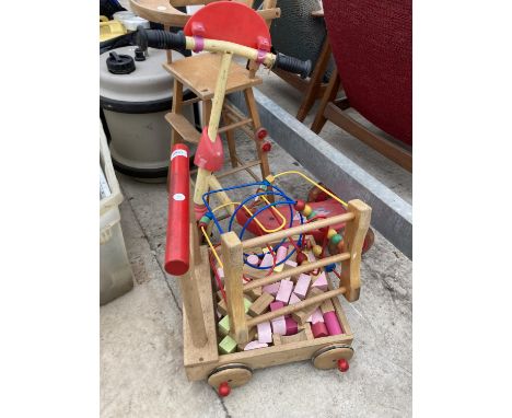 AN ASSORTMENT OF CHILDRENS ITEMS TO INCLUDE A HIGH CHAIR, A SCOOTER AND A WALKER ETC 