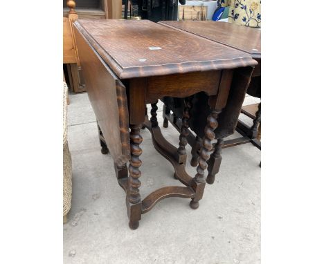 AN EARLY 20TH CENTURY OAK BARLEY TWIST GATE LEG DINING TABLE 