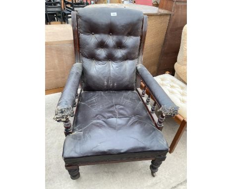 A VICTORIAN BUTTON BACK FIRESIDE CHAIR WITH TURNED ARM SPINDLES 