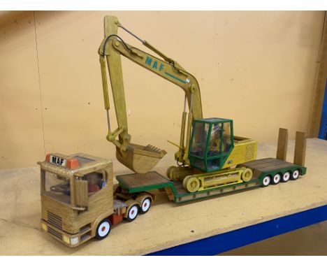 A LARGE MATCHSTICK MODEL BUILT FROM SCRATCH OF AN ARTICULATED TILTING CAB LORRY WITH AND DIGGER WITH ROTATING CAB AND MOVING 