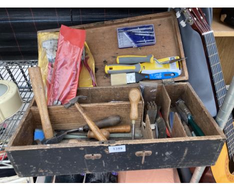 A WOODEN TOOL CHEST CONTAINING AN ASSORTMENT OF TOOLS TO INCLUDE HAMMERS, CHISELS AND PLIERS ETC 