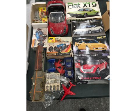 A COLLECTION OF KITS TO INCLUDE FIAT X1/9, TOYOTA MR2, MATCHBOX BUGATTI T/59 AND OTHER MODELS ETC. 