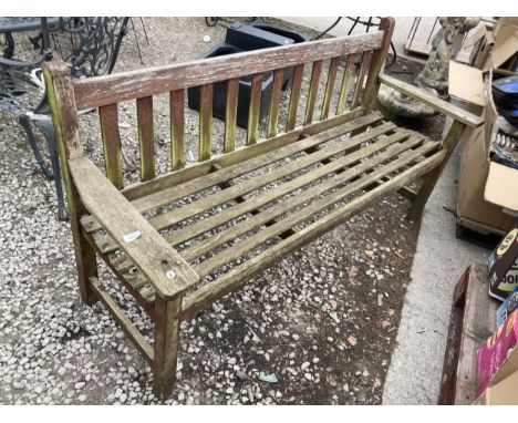 A WOODEN SLATTED GARDEN BENCH 