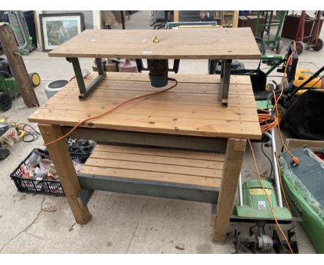 A WOODEN WORK BENCH AND A ROUTER TABLE COMPLETE WITH ROUTER 