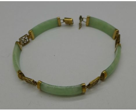 A 9ct gold mounted jade bracelet