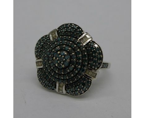 A 9ct white gold and blue diamond cluster ring, 4.1g, N