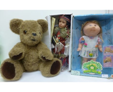 A Cabbage Patch Kids doll, a porcelain Indian doll and a 1970's Teddybear