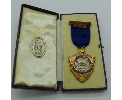 A silver and enamel Derby Chamber of Commerce medallion