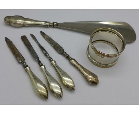 A silver napkin ring, silver handled manicure items and a shoe horn