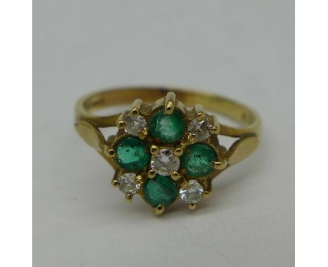 A 9ct gold, diamond and emerald ring, 2g, N