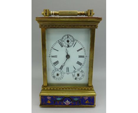 A brass and enamel decorated carriage clock, height with handle 19.5cm