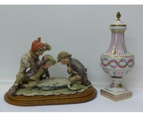 A Neapolitan figure group of three boys playing, signed G. Orauius and a French decorative vase and a cover signed La Reine, 