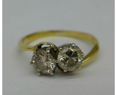 A yellow metal set, two stone diamond ring, 3.1g, N, over 1 carat total diamond weight