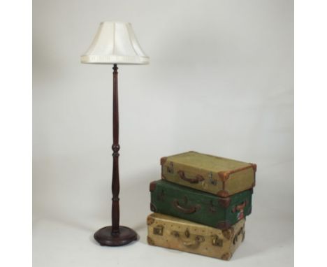 A stained beech framed standard lamp with cream shade, on circular base, 169cm high, and three various wax canvas and leather