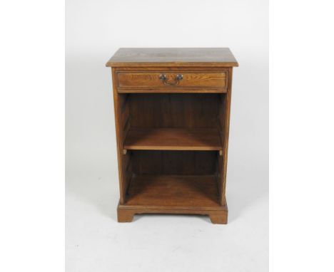 A modern oak low wall unit with rectangular top above a frieze drawer and adjustable shelf on bracket feet, 60cm wide, 38cm d