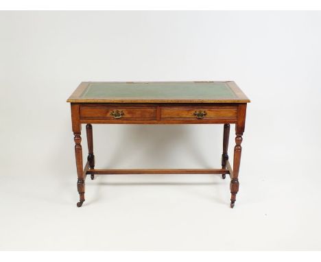 An Edwardian mahogany washstand converted to a desk, the plain top with later green tooled leather skiver above two frieze dr