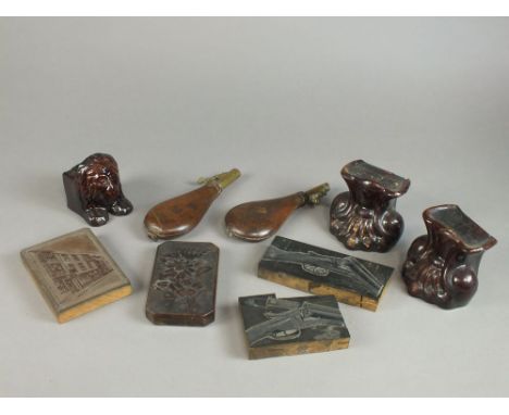 Tray containing two leather wrapped Victorian brass shot flasks, a treacle glazed lion sash window rest and a pair of treacle
