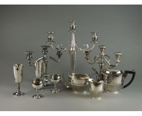 A large collection of silver plated items, to inlcude; a set of twelve tall goblets, an oval tray, a three piece tea service,