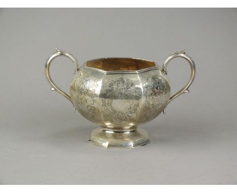 A Victorian silver two handled sugar bowl, *W, London 1842, of octagonal pedestal form with bright cut engraved scroll decora