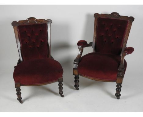 A Victorian machine made walnut framed open arm chair in later claret covers on ring turned legs and ceramic casters and a ma