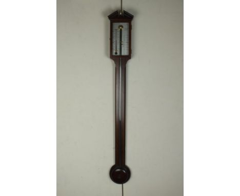 A George III style mahogany and boxwood strung stick barometer, in architectural case, with silvered dial signed 'A Comitti a