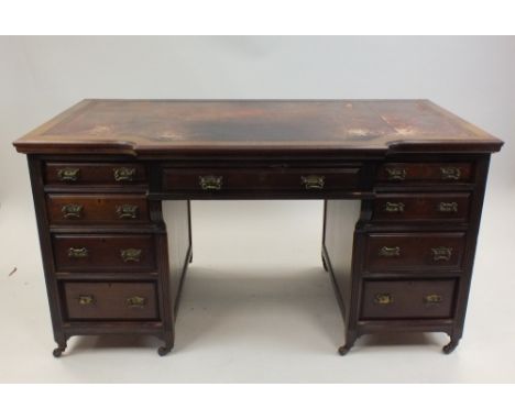 An Edwardian mahogany pedestal desk attributed to Shapland & Petter Barnstaple, the rectangular breakfront top with inset mor