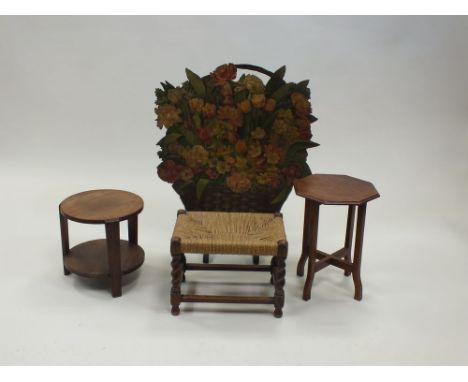 A painted fire screen in the form of a basket of flowers, early 20th century, 80cm high, a string top stool, a small octagona