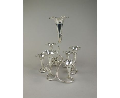 A silver plated epergne, designed as a central raised fluted trumped vase, within a surround of six smaller trumpet vases, al