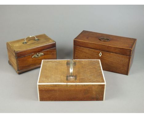 A George III mahogany and box wood strung tea caddy, the rectangular top enclosing two pull out tea boxes, 31cm wide, an Edwa