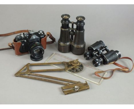 A selection of binoculars, tripod, Zenit SLR camera, PSL-AICO zoom duplicator lens, plexi-glass and brass compass protractor 