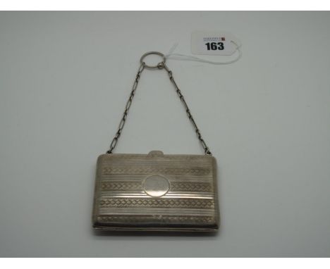 A Hallmarked Silver Case, J.G Ltd, Birmingham 1921, of rectangular form allover engine turned, on fancy link chain suspension