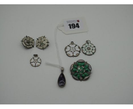 A Hallmarked Silver and Green Enamel Yorkshire Rose Brooch, highlighted in green (loss) J.F, Birmingham 1912; later white ena