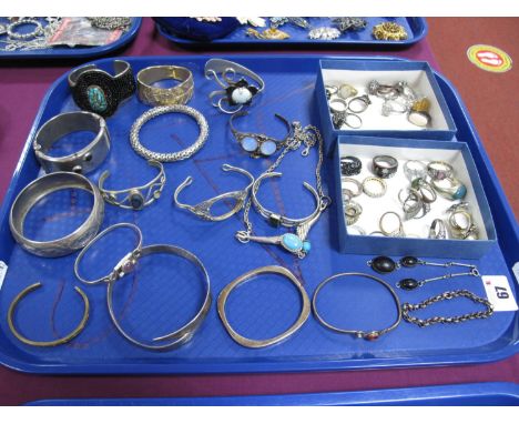 Assorted Modern Dress Rings, bangles (stones missing), hinged bangle stamped "925", etc:- One Tray