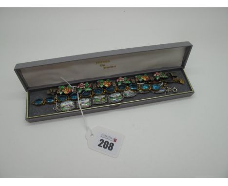 A Vintage Enamel Panel Bracelet, detailed in relief with flowerheads, to snap clasp stamped "Harmony Silver" (overall length 