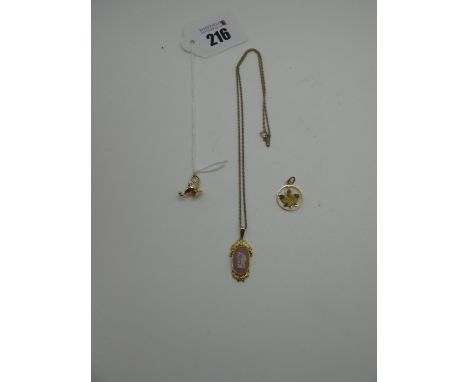 A 9ct Gold 'Genie' Lamp Charm Pendant, (0.5grams); together with a gilt and enamel maple leaf pendant, a pink and white Wedgw