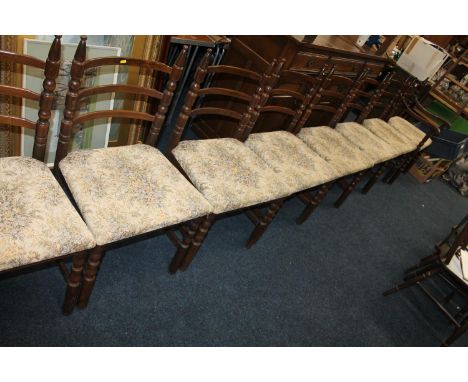 Set of eight oak ladder-back dining chairs, on turned supports. 