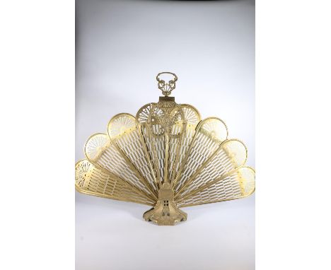 Brass peacock tail fireguard, 68cm tall.&nbsp; 