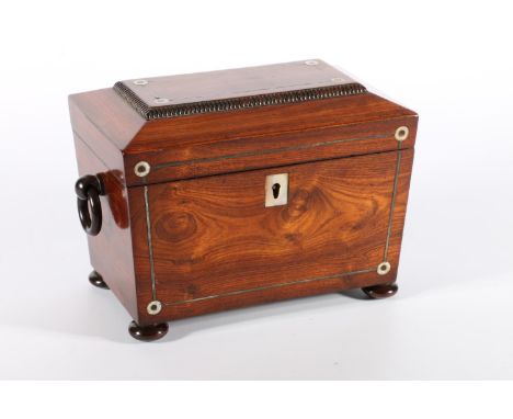Antique rosewood tea caddy of sarcophagus form, the top inlaid with mother of pearl opening to reveal a twin-division interio