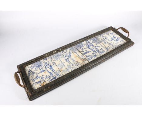 Antique serving tray with four inset blue and white pottery tiles depicting allegorical scenes, perhaps Minton, 71cm long.   