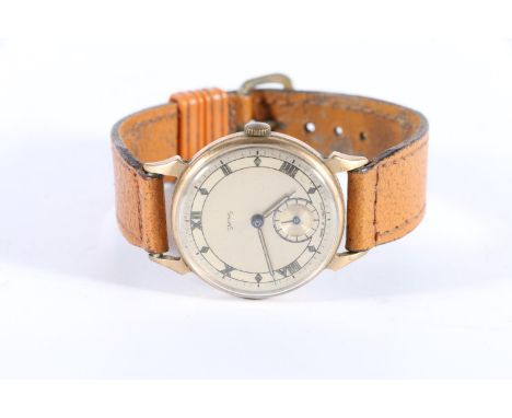 9ct gold Smiths gents wristwatch on tone leather strap.  Appears to be running once wound. Light marks to the dial and the ha