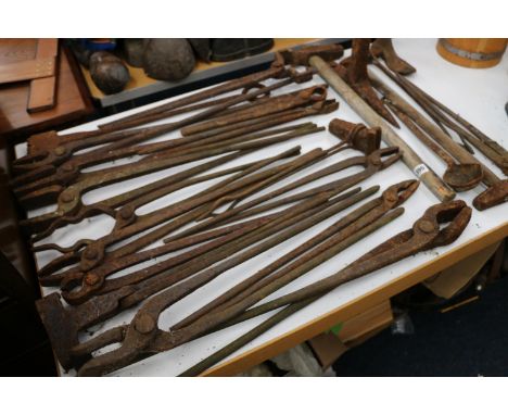 Collection of Blacksmiths tongs and other tools.&nbsp; 