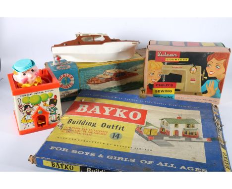 Vintage toys to include a Scalex Boats 414S Derwent Cabin Cruiser boxed, a Vulcan Countess sewing machine boxed, Bayko Buildi