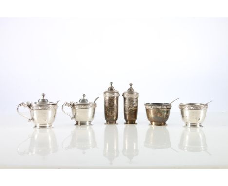 Contemporary silver six-piece cruet set decorated with Scottish Celtic style bosses, having four matching salt spoons, all by