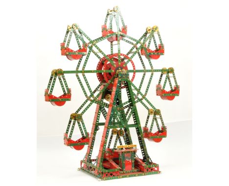 Meccano Scratch Built model of a Ferris wheel in mixed colours of red and green with some parts restored. Condition is Fair.&