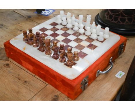 Carved onyx chess set and board in fitted case, the board 32 cm x 32 cm, the king 6 cm h